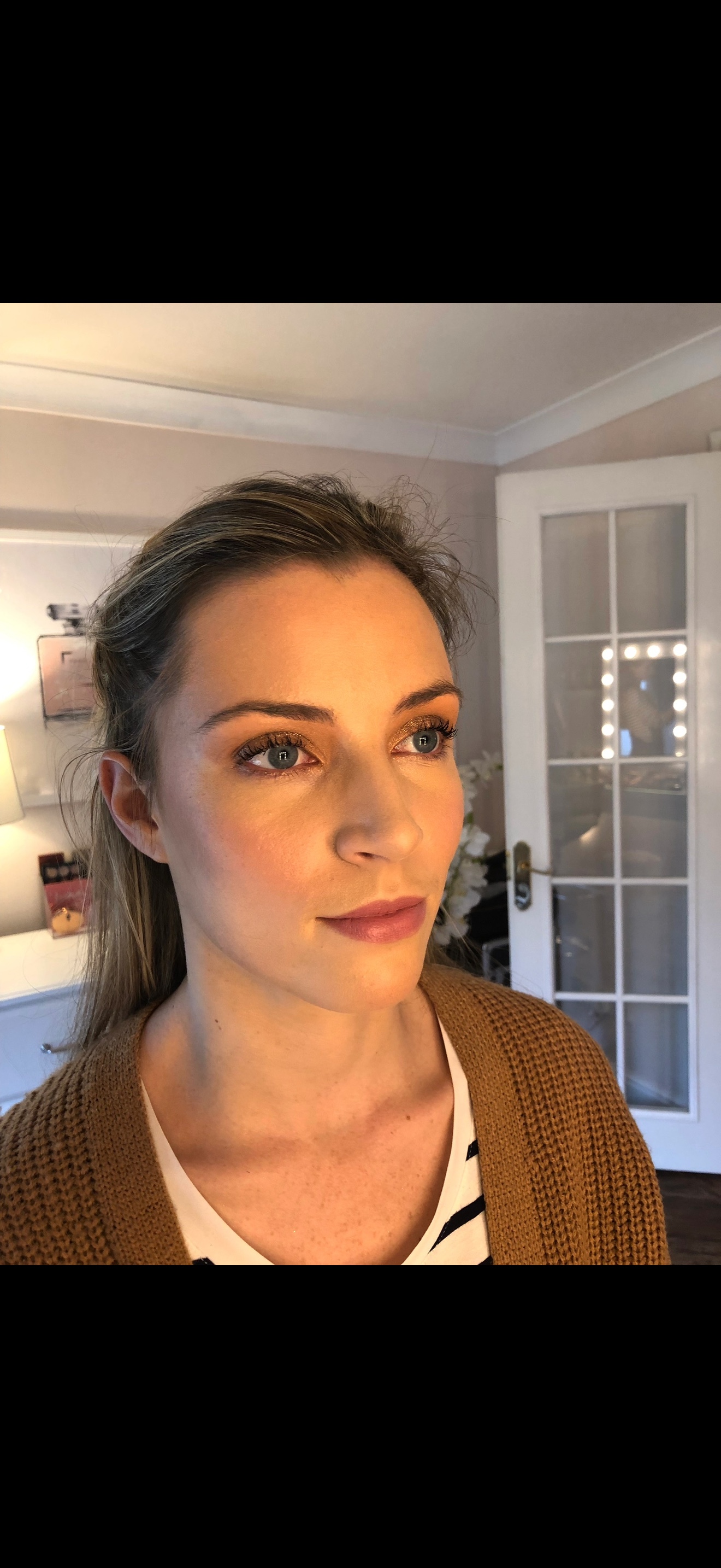 Client portrait with subtle eye definition and a muted rose lip
